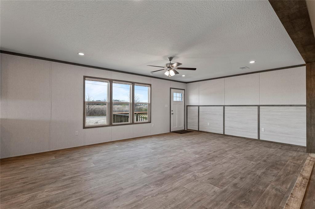 3888 Sandusky Road Whitesboro, TX 76273 - Photo 5 of 24 Unfurnished bedroom featuring light wood-type flooring, crown molding, a ceiling fan, recessed lighting, and a textured ceiling