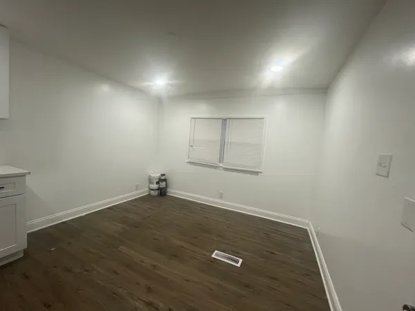 a kitchen with stainless steel appliances a refrigerator sink and microwave