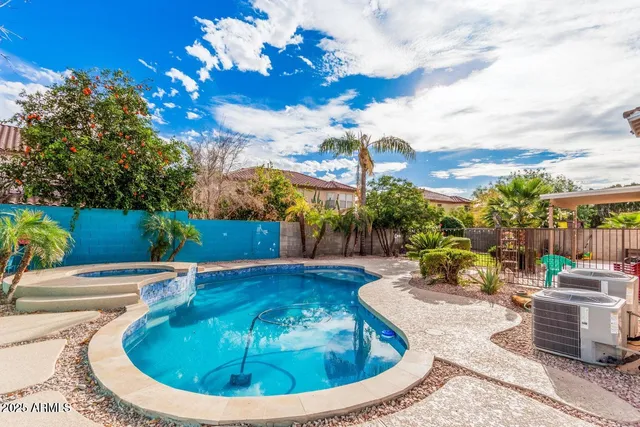 a view of a swimming pool with a patio