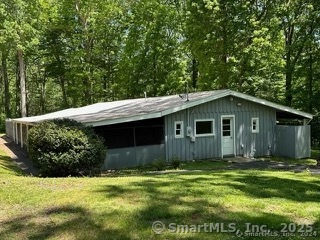 202 Crane Hollow Road Bethlehem, CT 06751 - Photo 20 of 36 a backyard of a house with lots of green space