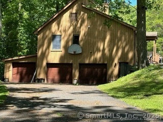 202 Crane Hollow Road Bethlehem, CT 06751 - Photo 2 of 36 a view of a house with a street