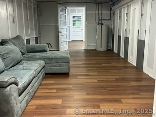 202 Crane Hollow Road Bethlehem, CT 06751 - Photo 26 of 36 a living room with furniture and a rug