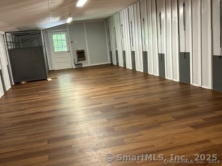 202 Crane Hollow Road Bethlehem, CT 06751 - Photo 29 of 36 an empty room with wooden floor and windows