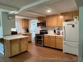 202 Crane Hollow Road Bethlehem, CT 06751 - Photo 3 of 36 a kitchen with a refrigerator a stove top oven a sink and cabinets