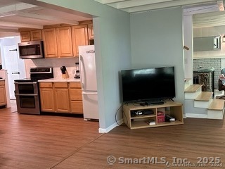 202 Crane Hollow Road Bethlehem, CT 06751 - Photo 7 of 36 a living room with furniture and a flat screen tv