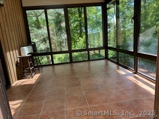 202 Crane Hollow Road Bethlehem, CT 06751 - Photo 9 of 36 a view of a porch with wooden floor and outdoor space