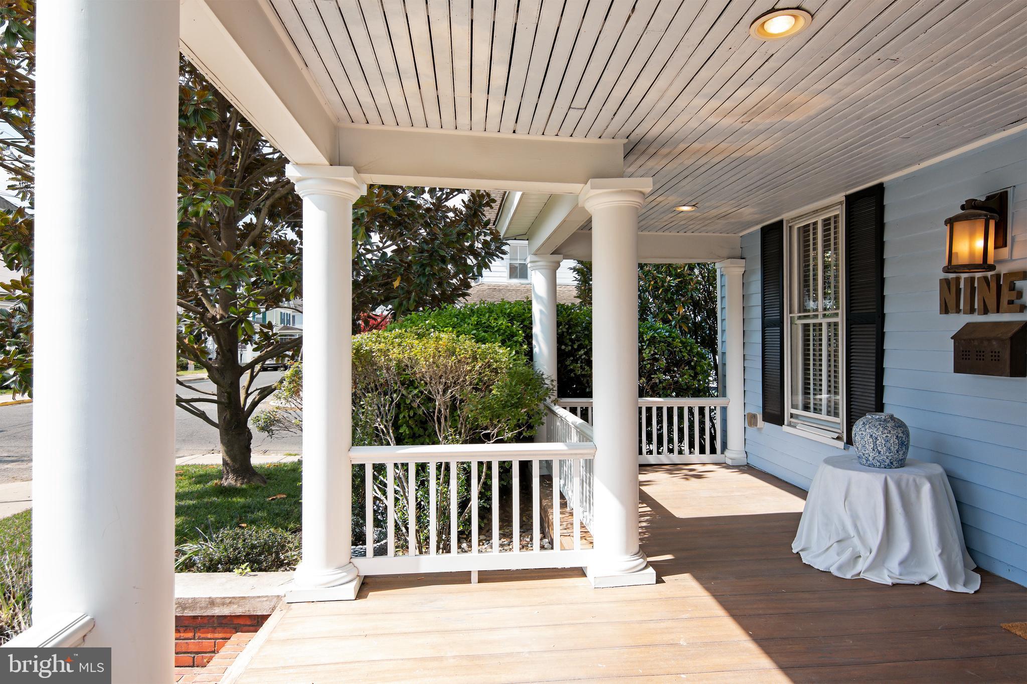a view of a patio with a table chairs and a porch