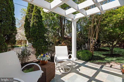 a view of a chairs and table in the patio