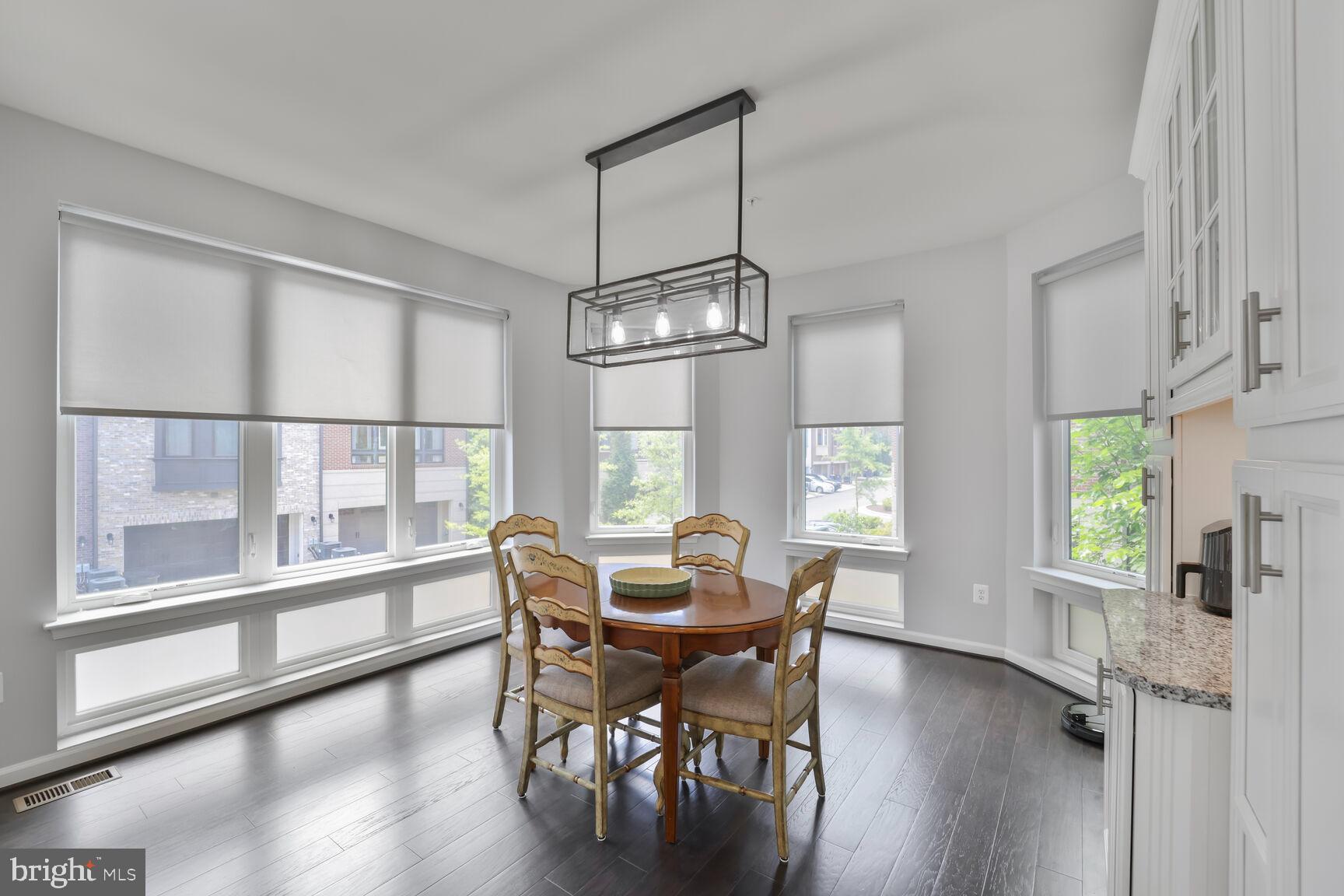 515 Riversail Lane, Unit 430 Oxon Hill, MD 20745 - Photo 12 of 54 a view of a dining room with furniture window and wooden floor