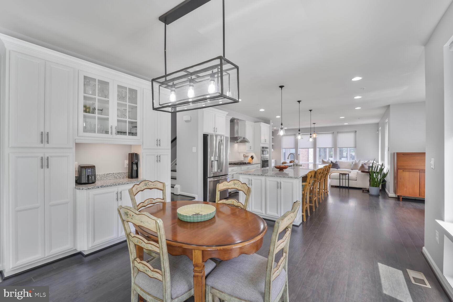 515 Riversail Lane, Unit 430 Oxon Hill, MD 20745 - Photo 13 of 54 a view of a dining room with furniture and wooden floor