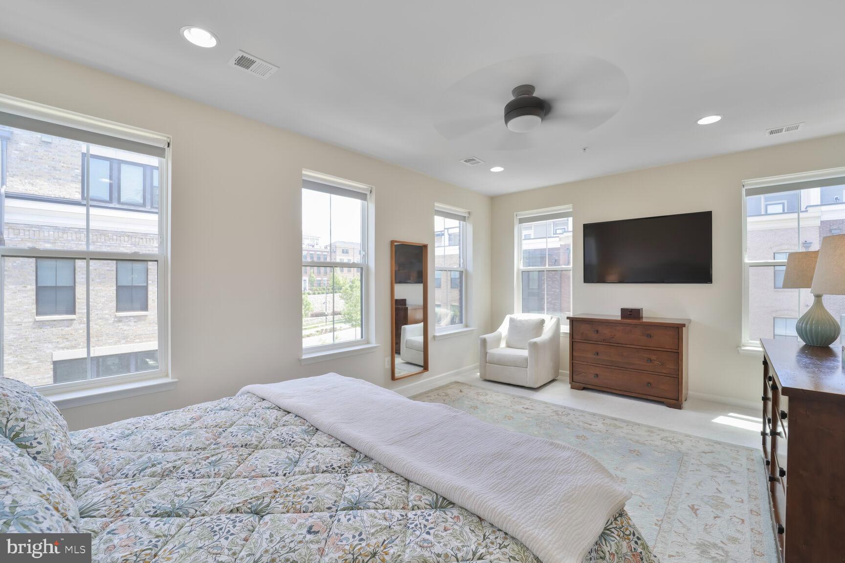 515 Riversail Lane, Unit 430 Oxon Hill, MD 20745 - Photo 19 of 54 a bedroom with furniture and a flat screen tv