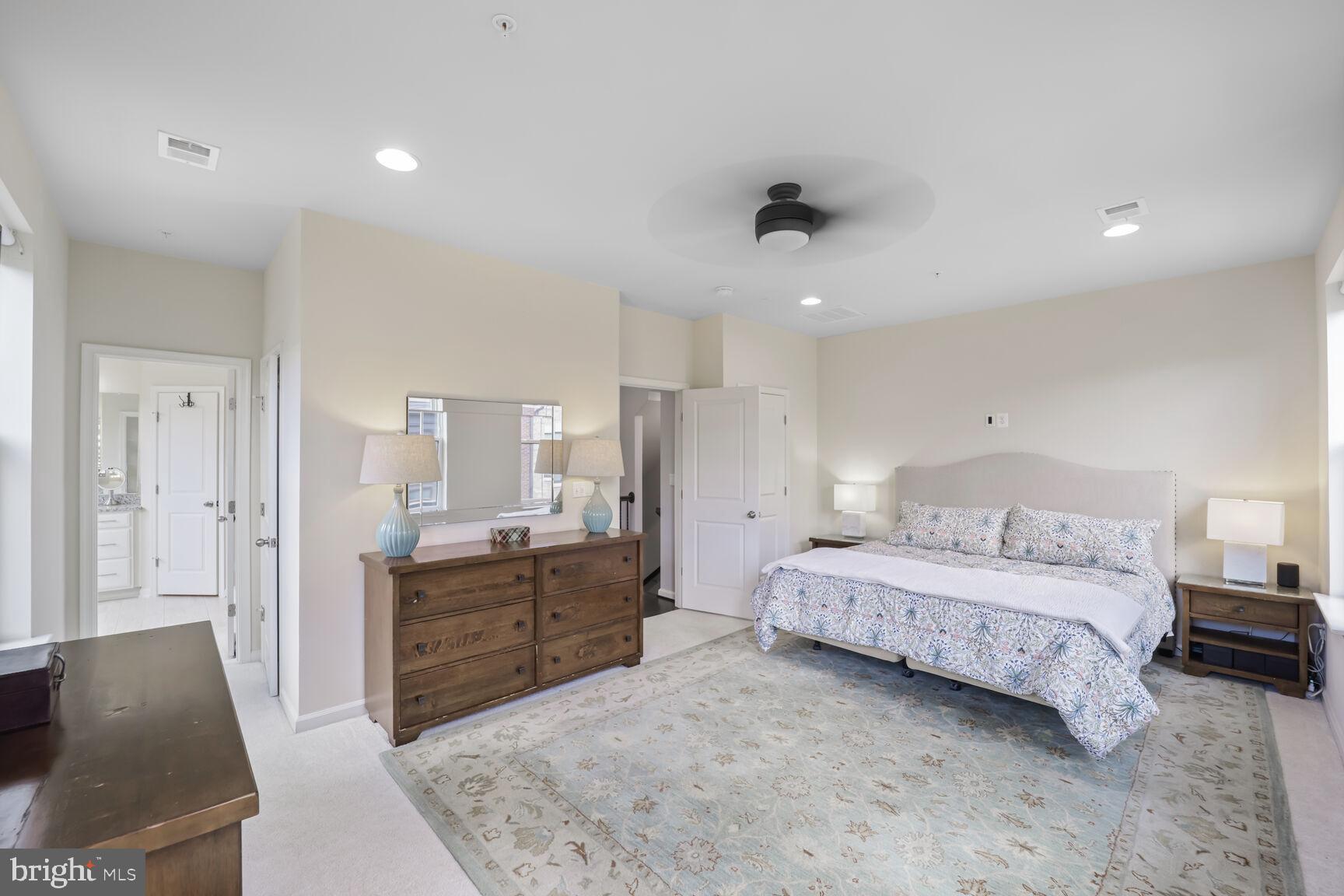 515 Riversail Lane, Unit 430 Oxon Hill, MD 20745 - Photo 20 of 54 a spacious bedroom with a bed and a dresser