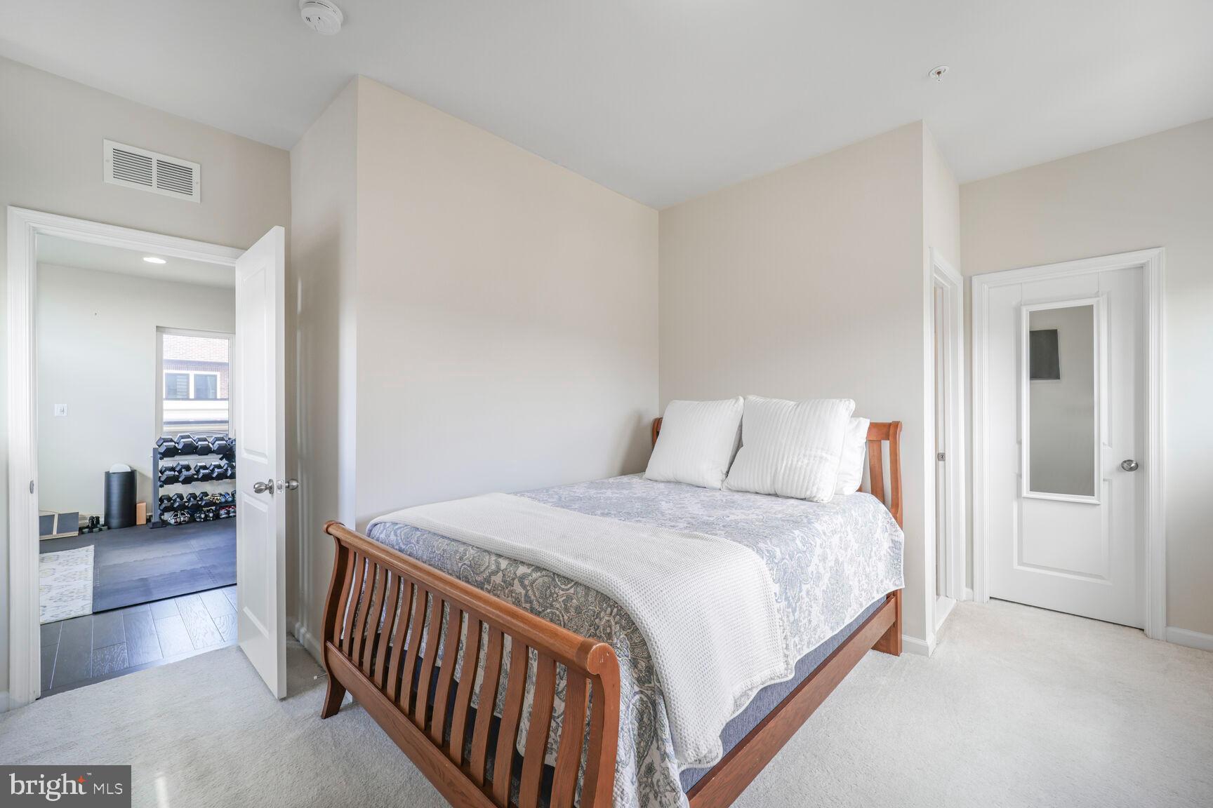 515 Riversail Lane, Unit 430 Oxon Hill, MD 20745 - Photo 28 of 54 a bedroom with a bed and a view of bedroom