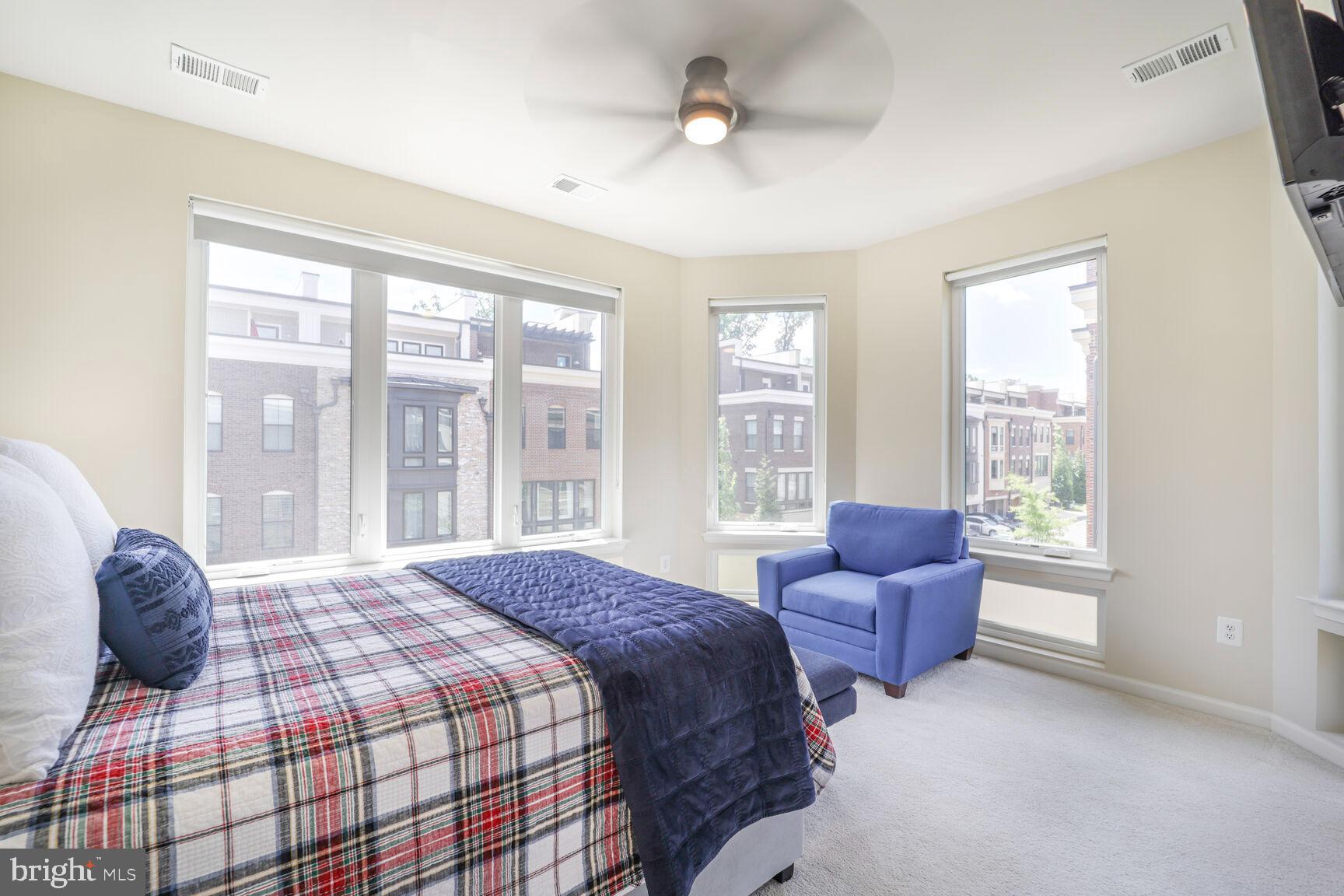 515 Riversail Lane, Unit 430 Oxon Hill, MD 20745 - Photo 32 of 54 a bedroom with a bed and glass window