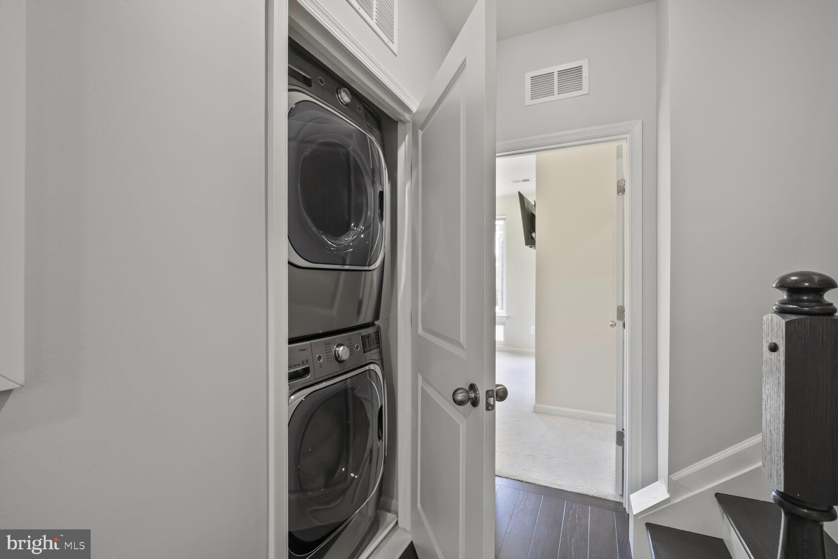 515 Riversail Lane, Unit 430 Oxon Hill, MD 20745 - Photo 36 of 54 a utility room with dryer and washer