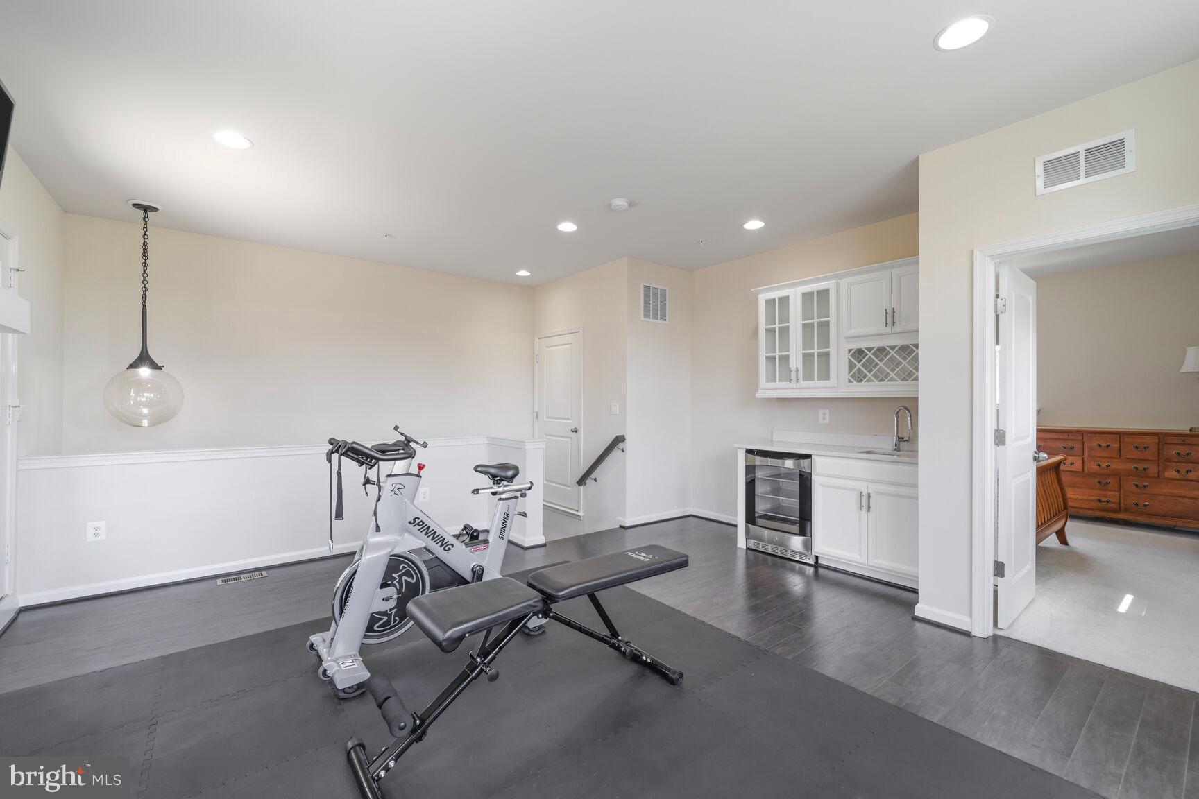 515 Riversail Lane, Unit 430 Oxon Hill, MD 20745 - Photo 39 of 54 a view of a room with furniture and wooden floor