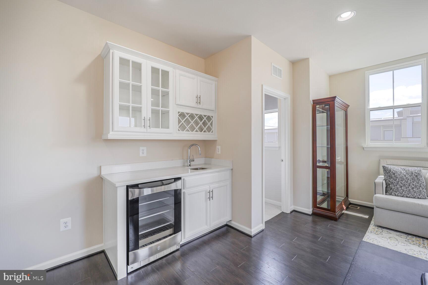 515 Riversail Lane, Unit 430 Oxon Hill, MD 20745 - Photo 41 of 54 a view of kitchen with furniture and wooden floor
