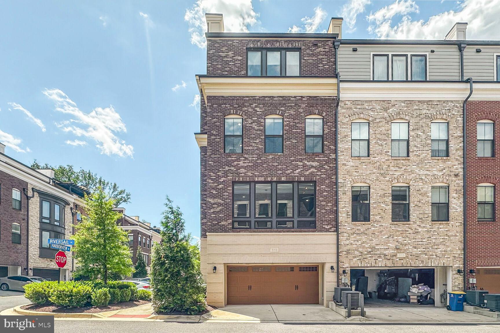 515 Riversail Lane, Unit 430 Oxon Hill, MD 20745 - Photo 49 of 54 a front view of a building with a tree