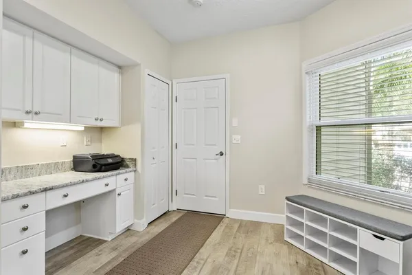 a kitchen with a stove a sink and a window