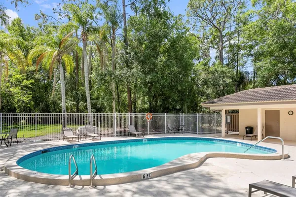 a view of a swimming pool with a patio