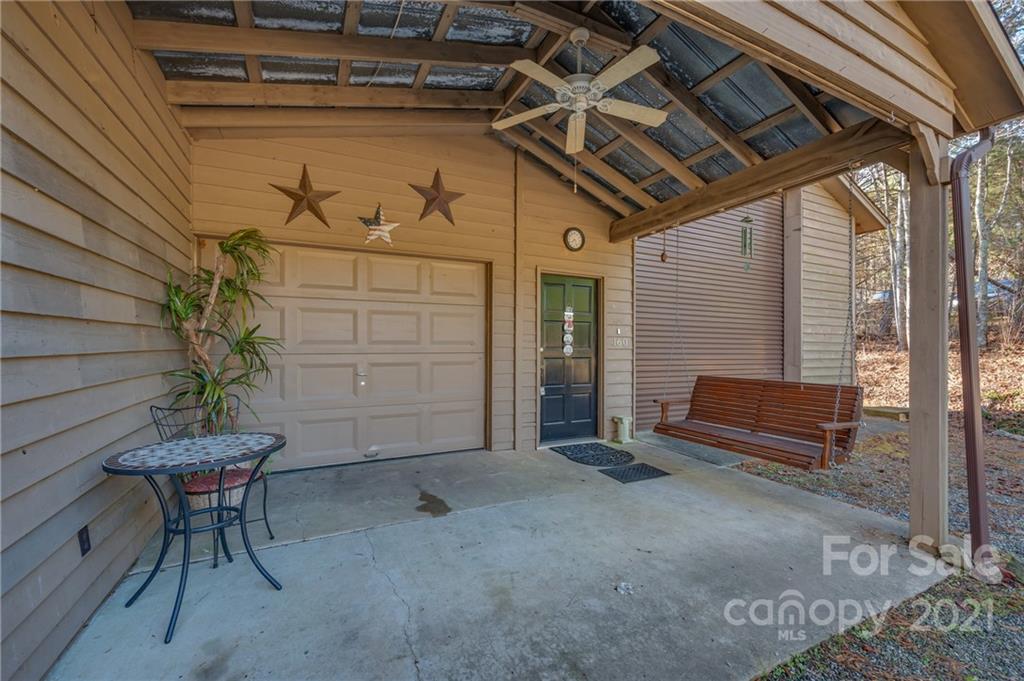 160 Fagan Drive Inman, SC 29349 - Photo 2 of 45 a view of a porch with wooden chairs and a bench