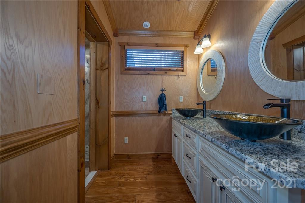 160 Fagan Drive Inman, SC 29349 - Photo 20 of 45 a kitchen with a granite countertop sink and a mirror