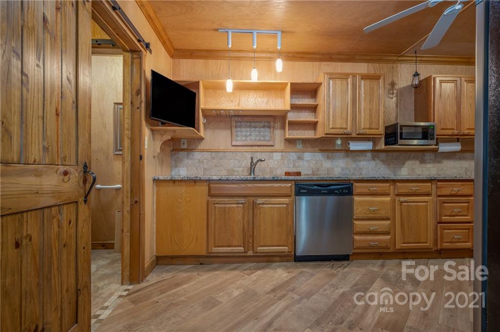 160 Fagan Drive Inman, SC 29349 - Photo 7 of 45 a kitchen with stainless steel appliances granite countertop a stove a sink and a microwave