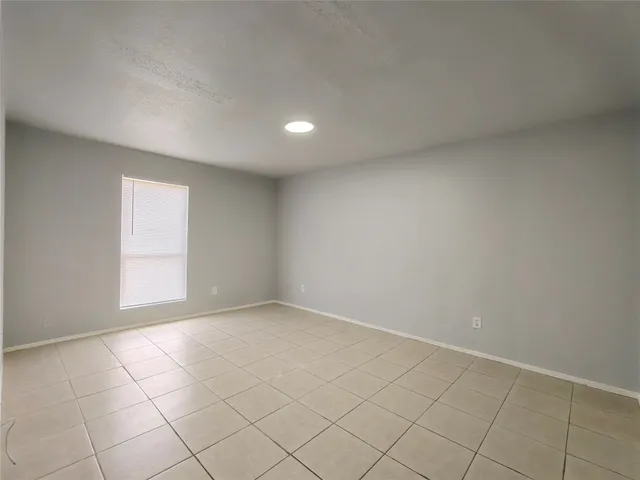 a view of an empty room and closet area