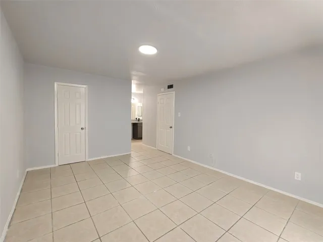 a white toilet sitting next to a bath tub
