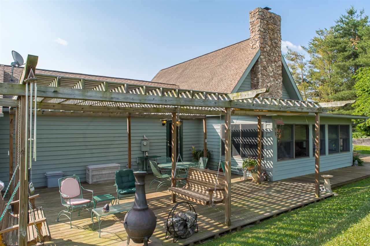72 Greenfield Road Fishersville, VA 22939 - Photo 12 of 50 a view of a house with outdoor seating and plants