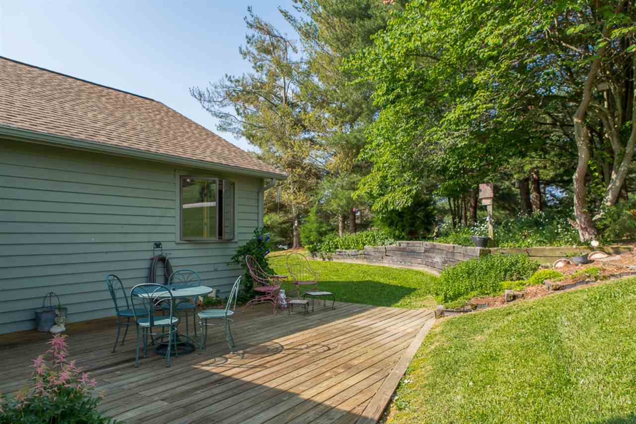 72 Greenfield Road Fishersville, VA 22939 - Photo 14 of 50 a view of a patio with table and chairs and wooden fence