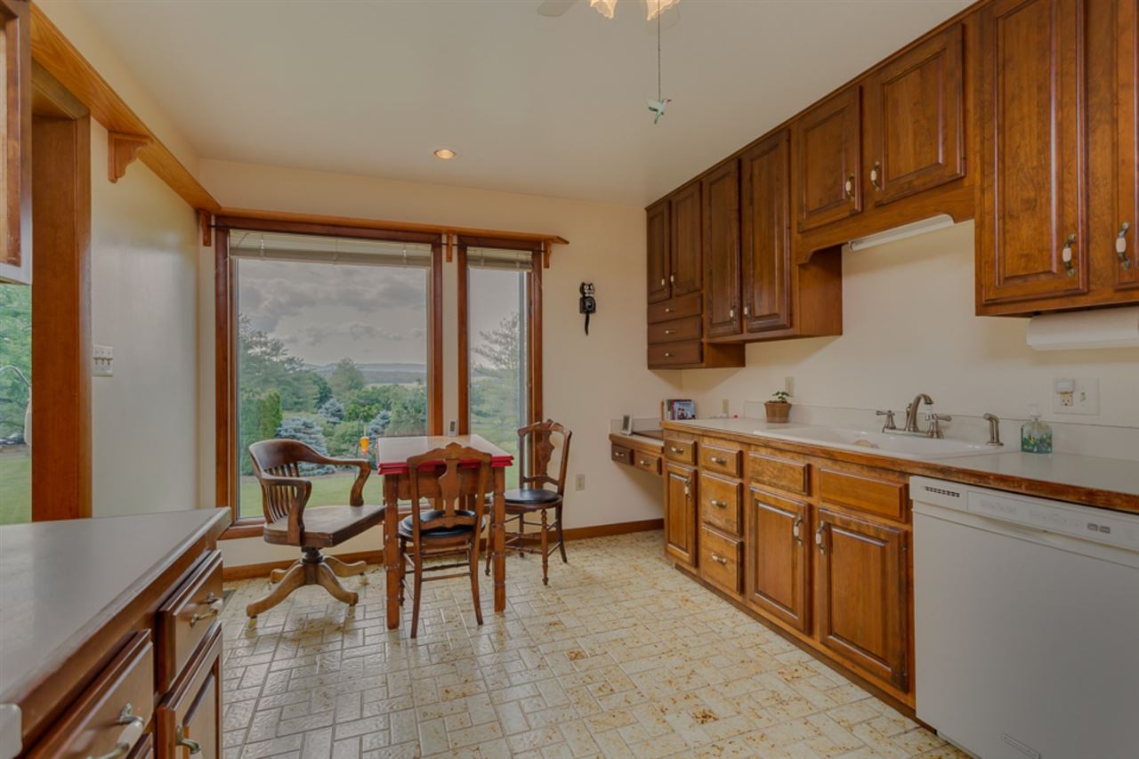 72 Greenfield Road Fishersville, VA 22939 - Photo 22 of 50 a kitchen with sink cabinets and dining table chair