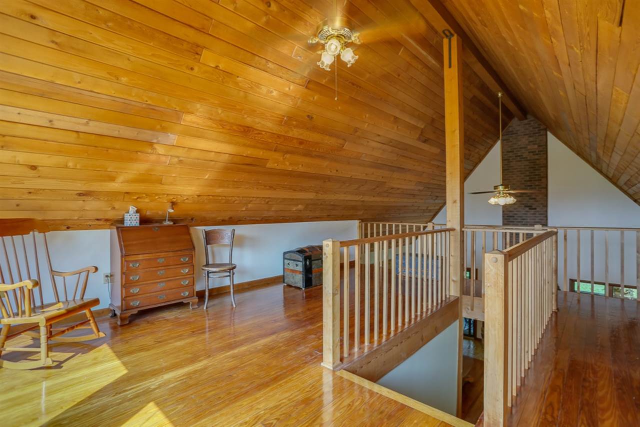 72 Greenfield Road Fishersville, VA 22939 - Photo 41 of 50 a view of a balcony with wooden floor and iron stairs