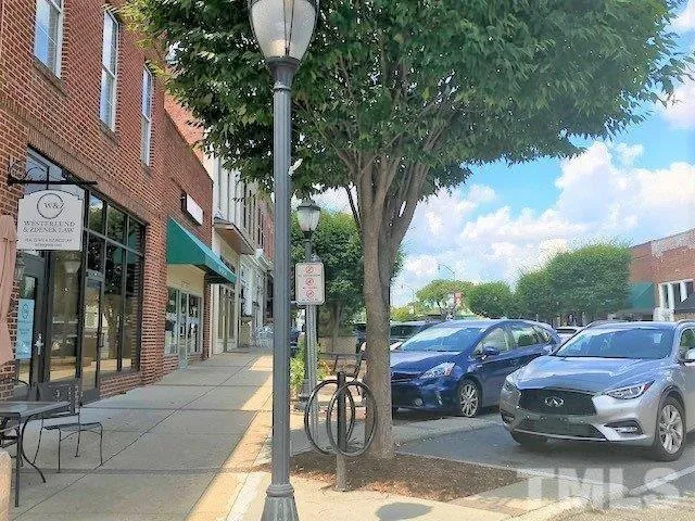 a view of street with parked cars
