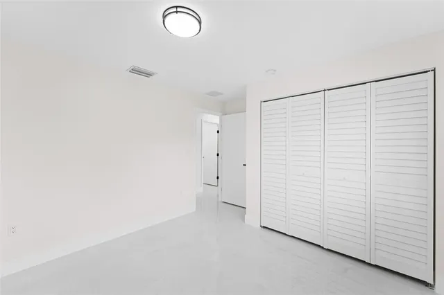 a view of a room with white walls
