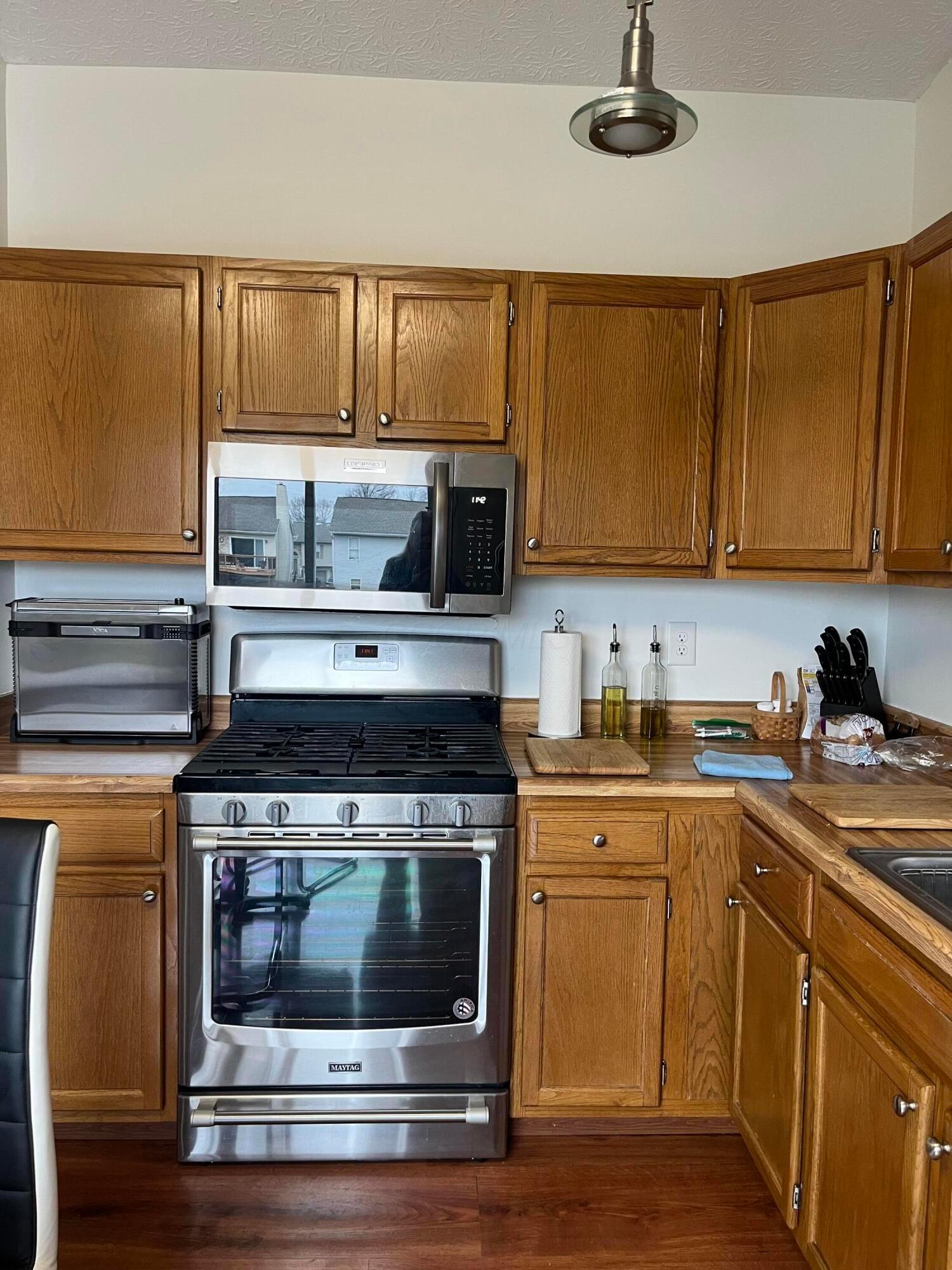1174 Obetz Road Columbus, OH 43207 - Photo 13 of 41 Kitchen has stainless steel new gas range and microwave