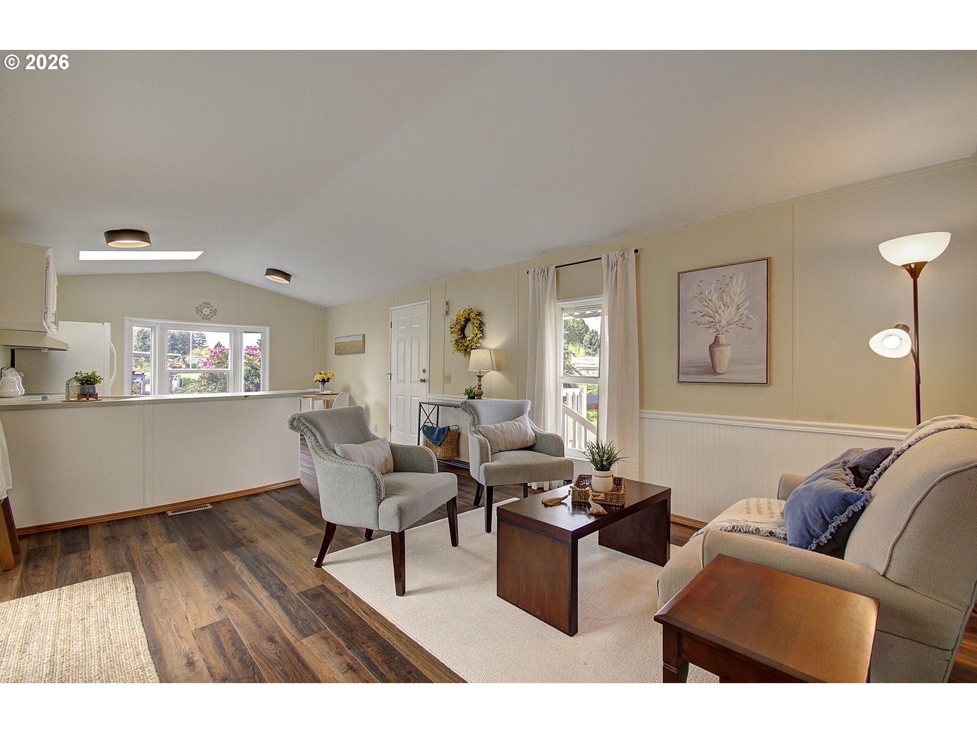 15619 Northeast Caples Road, Unit 150 Brush Prairie, WA 98606 - Photo 11 of 28 a living room with furniture and a wooden floor