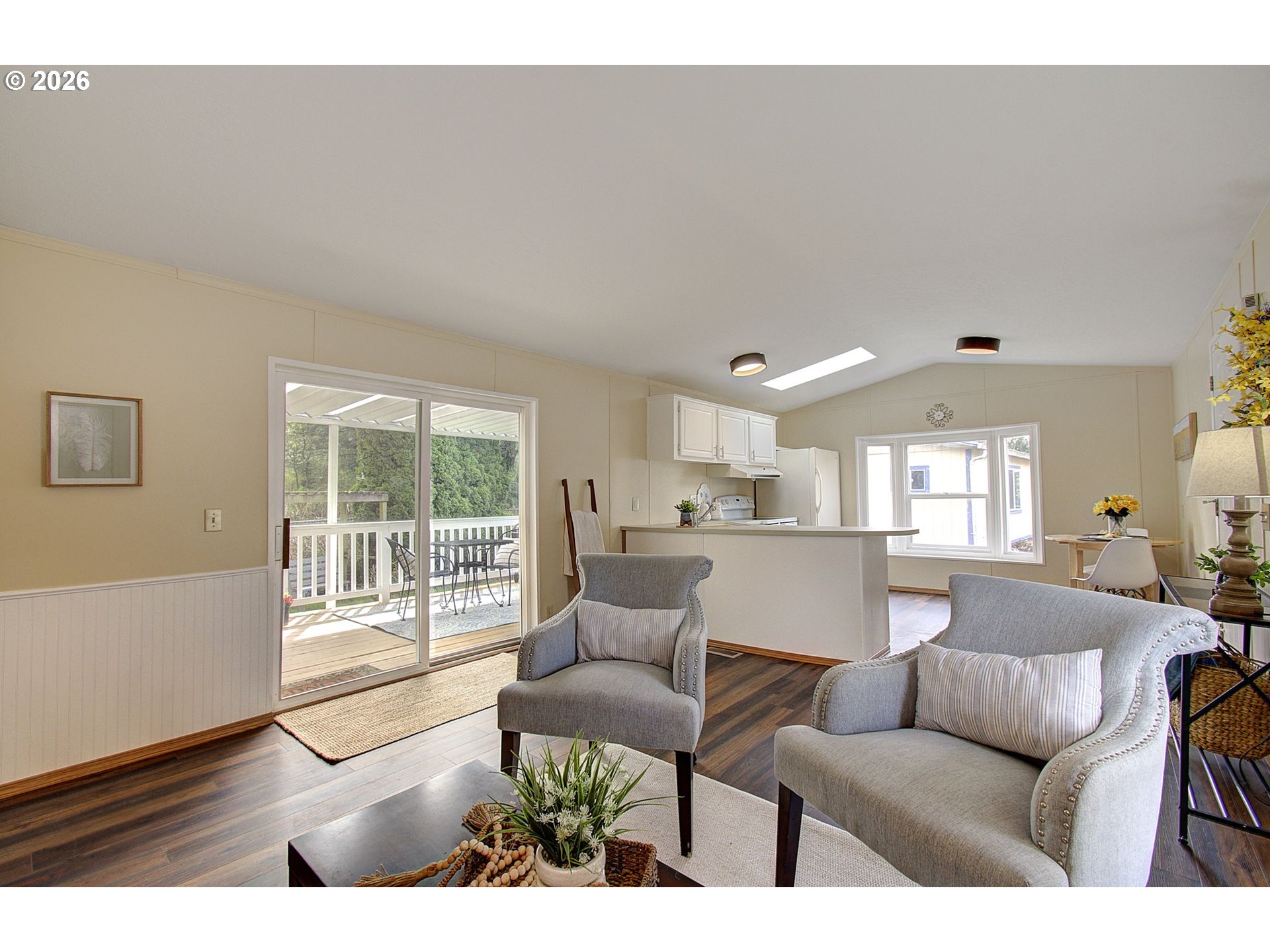 15619 Northeast Caples Road, Unit 150 Brush Prairie, WA 98606 - Photo 12 of 28 a living room with furniture and a large window