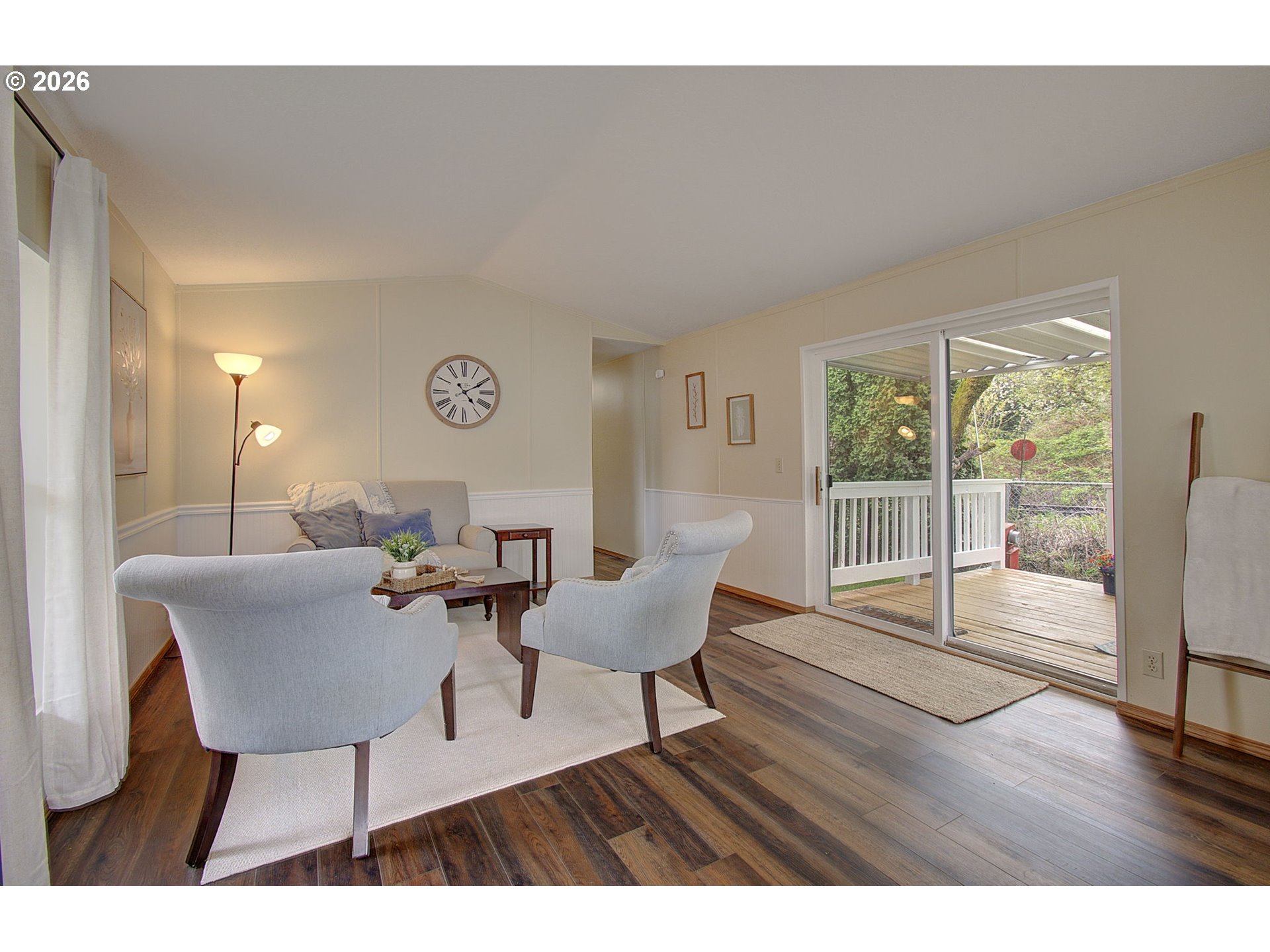 15619 Northeast Caples Road, Unit 150 Brush Prairie, WA 98606 - Photo 13 of 28 a living room with furniture and wooden floor