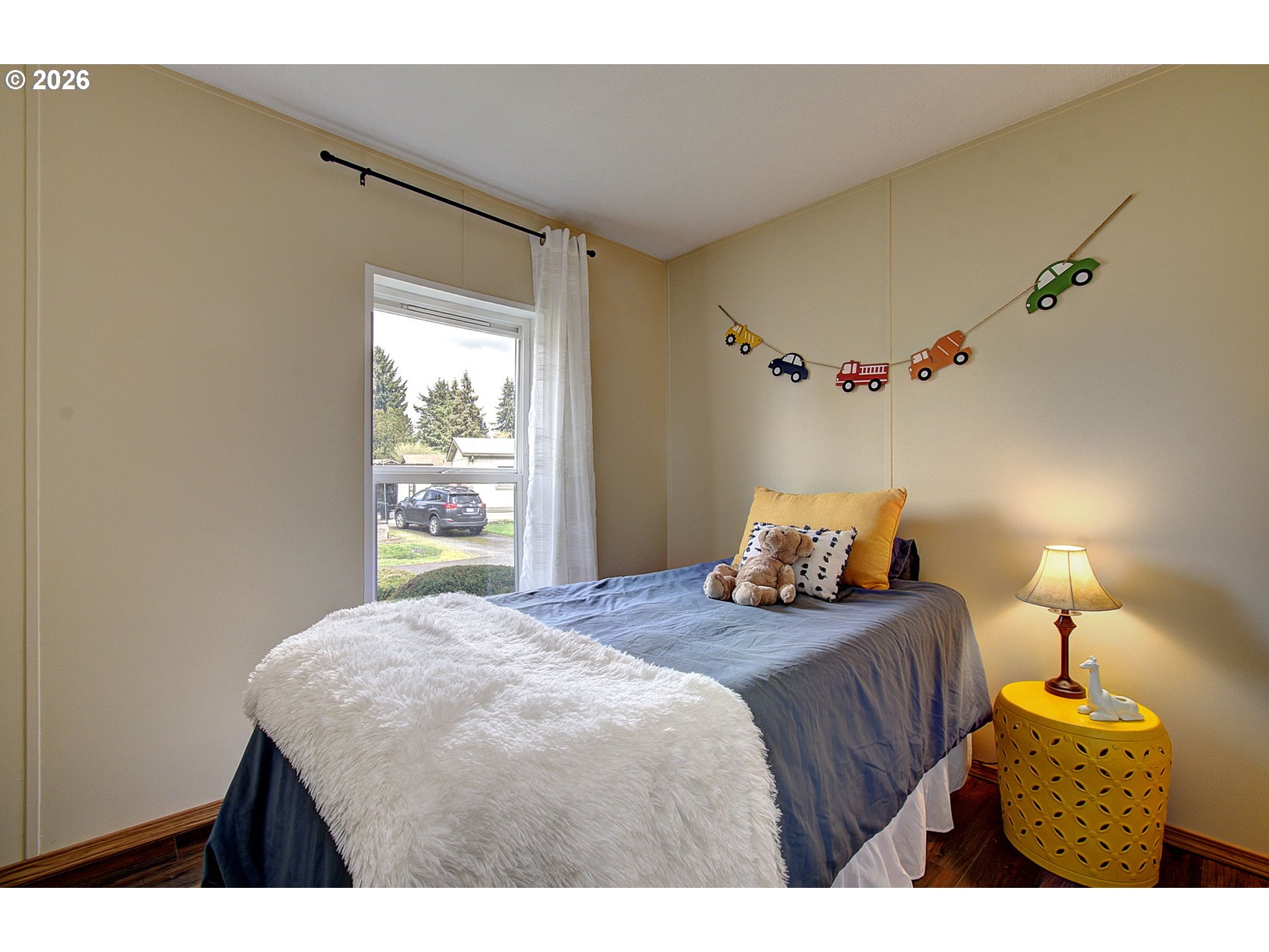 15619 Northeast Caples Road, Unit 150 Brush Prairie, WA 98606 - Photo 14 of 28 a bedroom with a bed and a window
