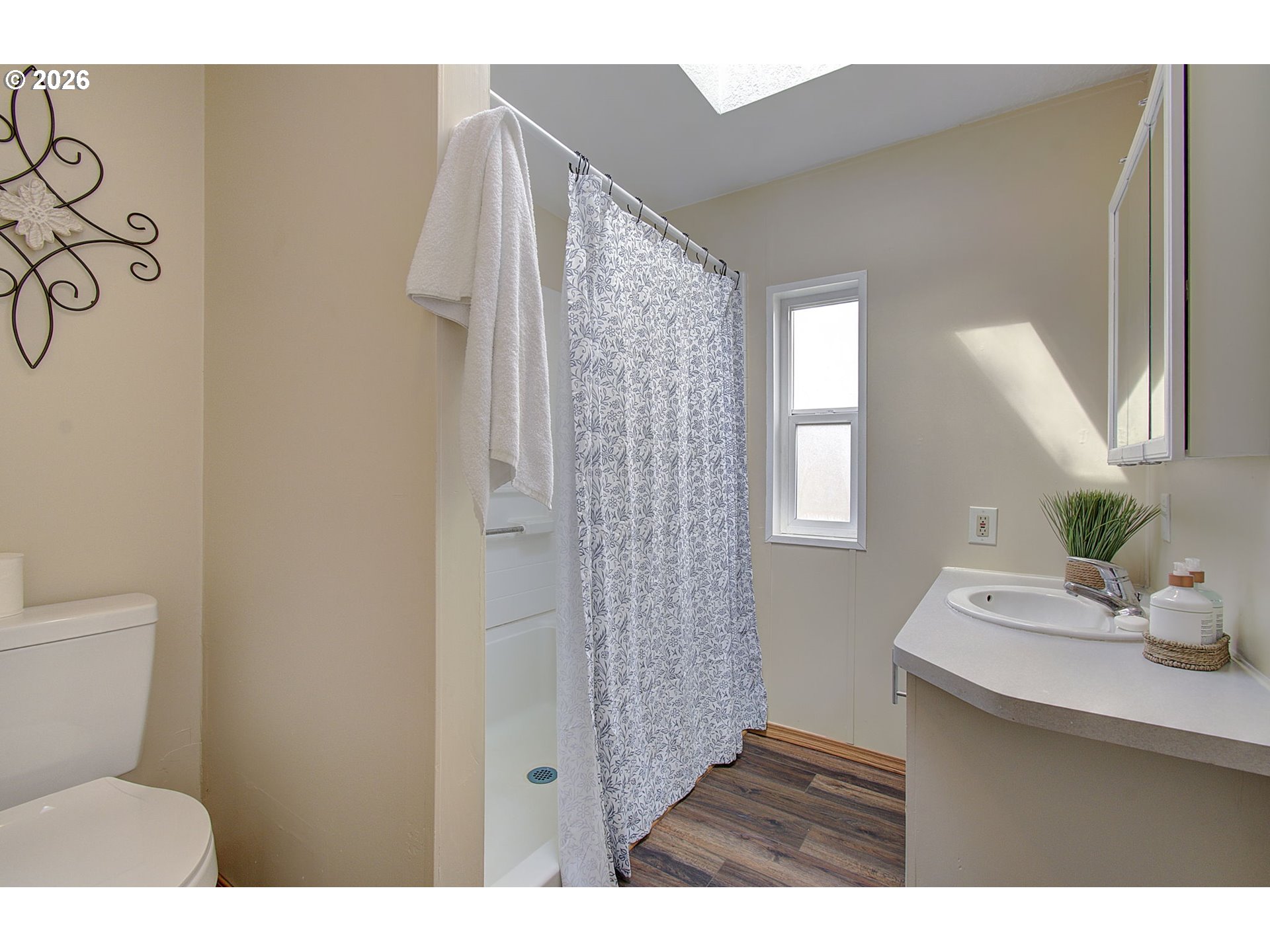 15619 Northeast Caples Road, Unit 150 Brush Prairie, WA 98606 - Photo 17 of 28 a bathroom with a sink toilet and shower