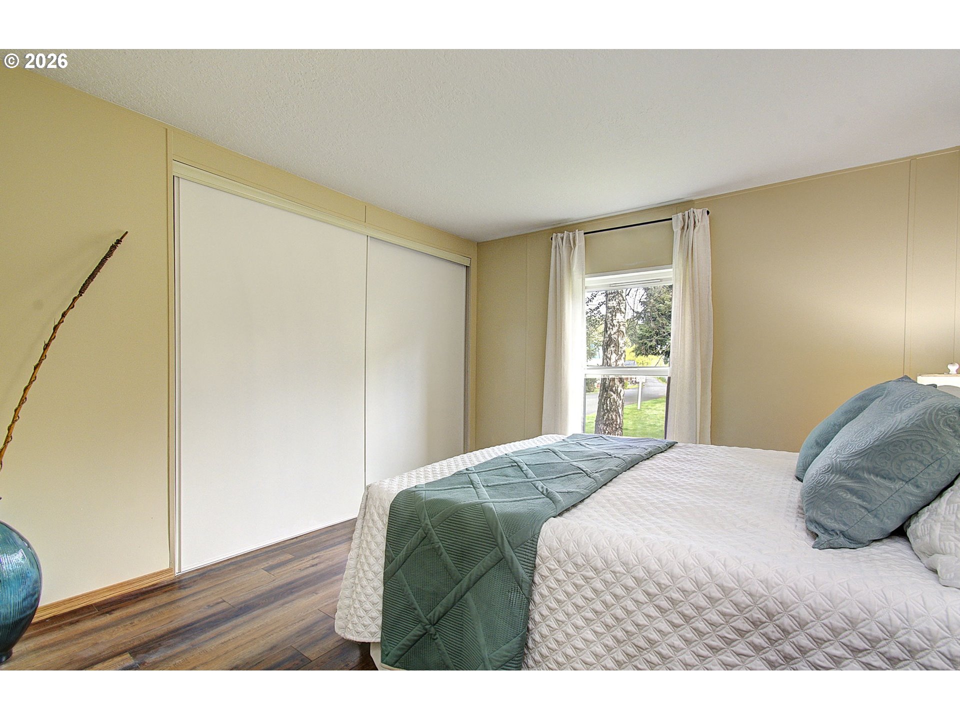 15619 Northeast Caples Road, Unit 150 Brush Prairie, WA 98606 - Photo 20 of 28 a bedroom with a bed and a window