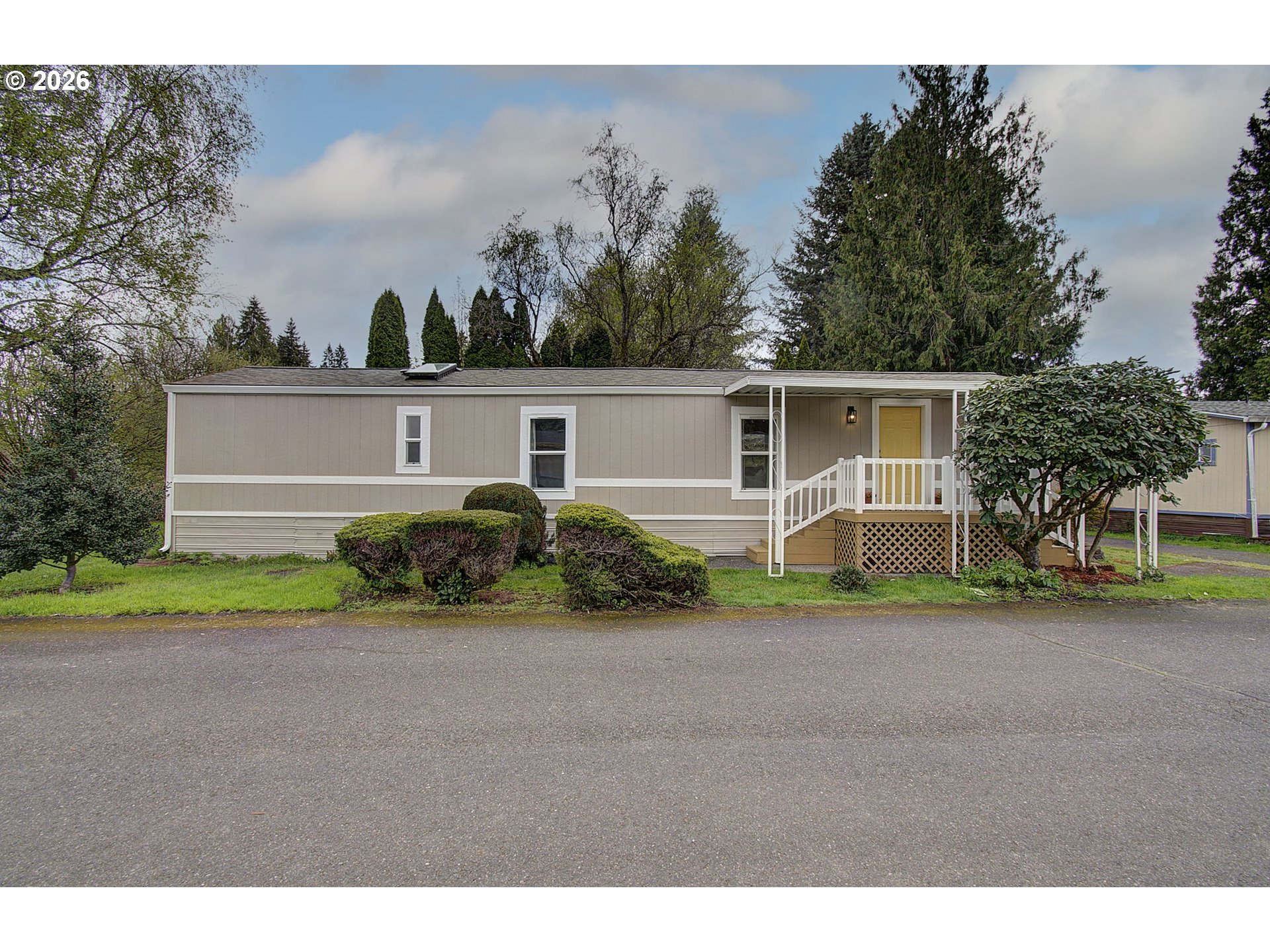 15619 Northeast Caples Road, Unit 150 Brush Prairie, WA 98606 - Photo 2 of 28 a view of a house with backyard and a garden