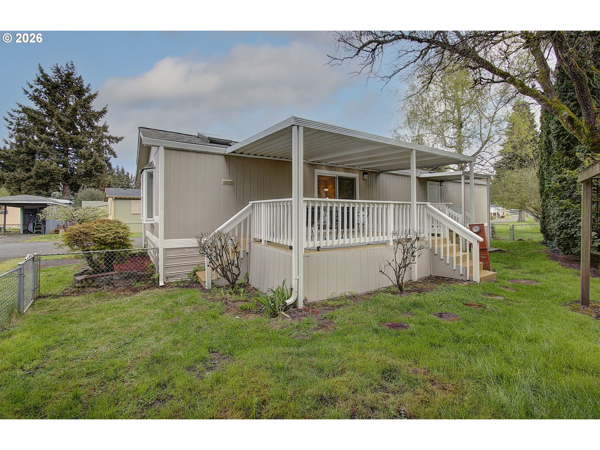 15619 Northeast Caples Road, Unit 150 Brush Prairie, WA 98606 - Photo 22 of 28 a view of a house with a yard
