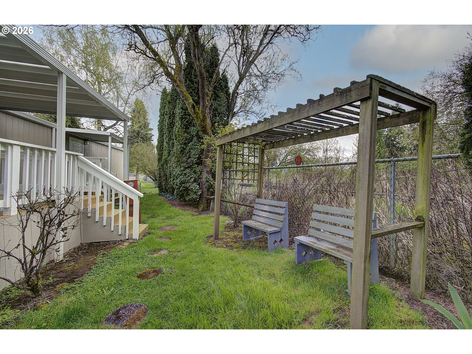 15619 Northeast Caples Road, Unit 150 Brush Prairie, WA 98606 - Photo 23 of 28 a view of a chair and table in backyard of the house