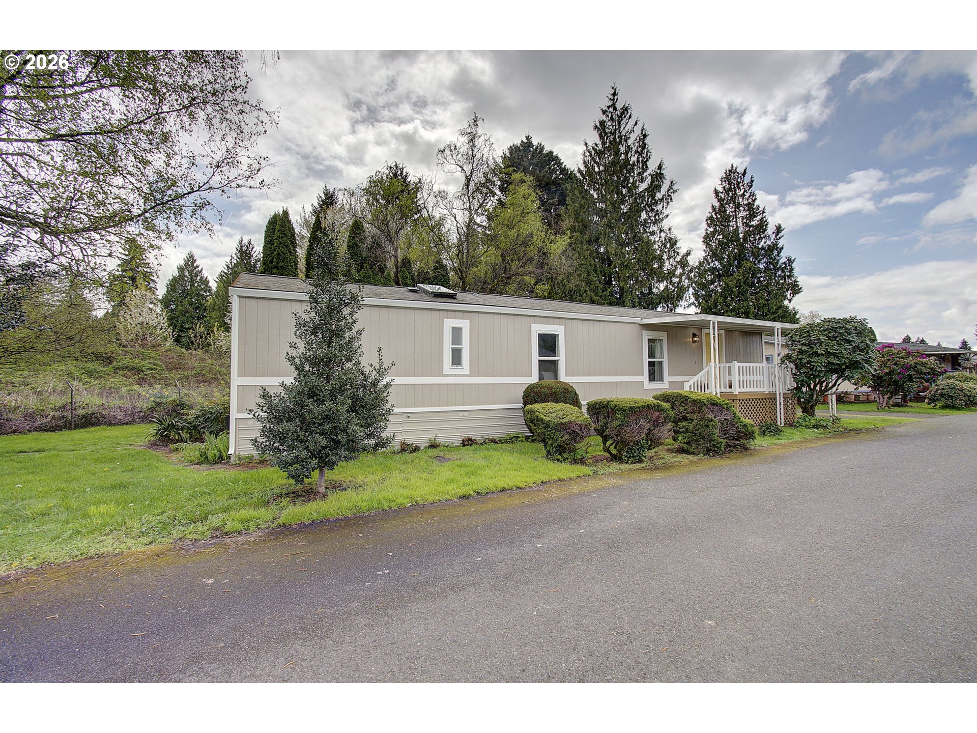 15619 Northeast Caples Road, Unit 150 Brush Prairie, WA 98606 - Photo 3 of 28 a view of a house with backyard and garden
