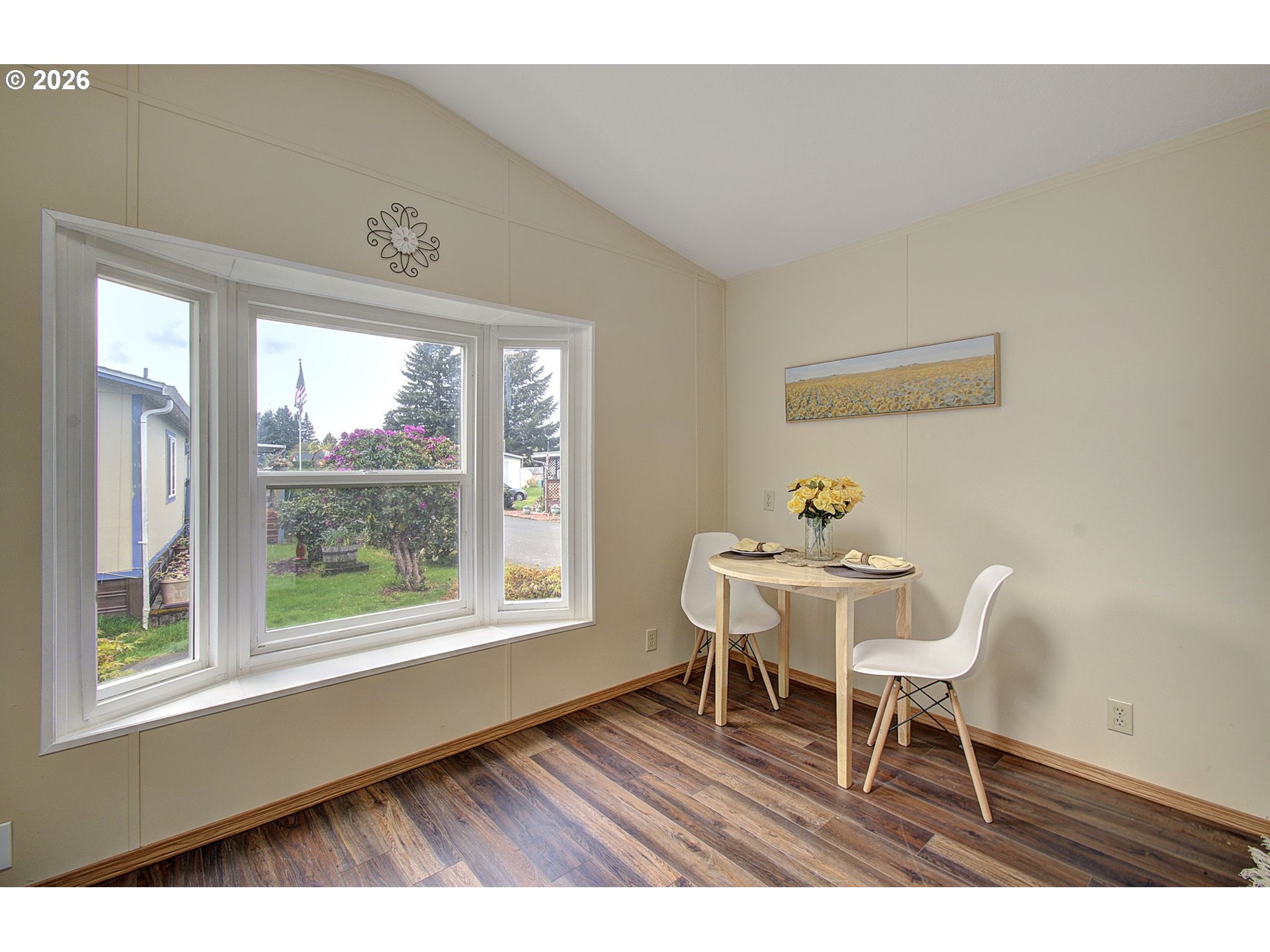 15619 Northeast Caples Road, Unit 150 Brush Prairie, WA 98606 - Photo 7 of 28 a dining room with furniture and wooden floor
