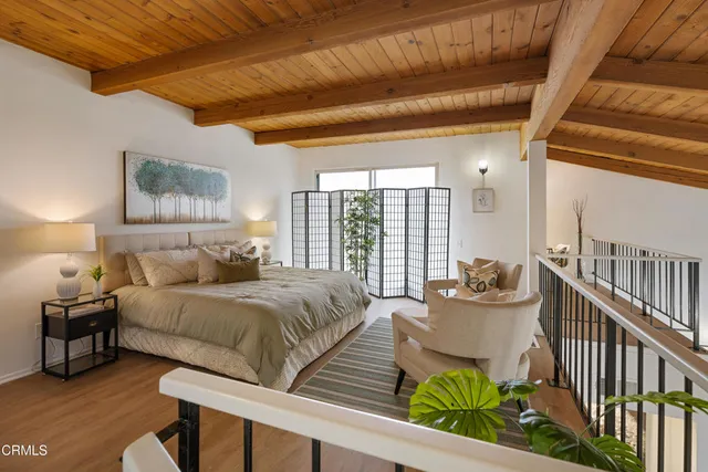 a bedroom with a bed and a couch