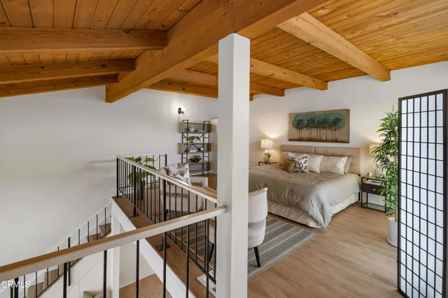 a bedroom with furniture and baby crib