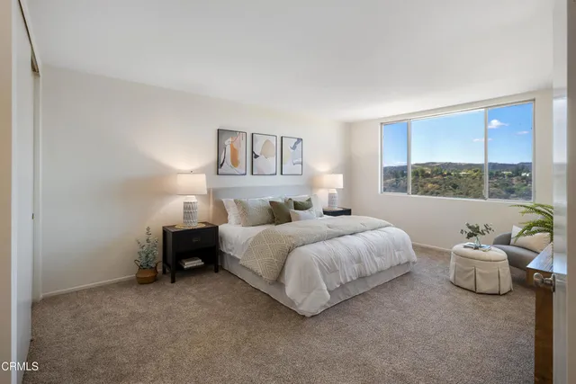 a bedroom with bed and window